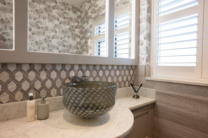 marble bathroom with glass basin